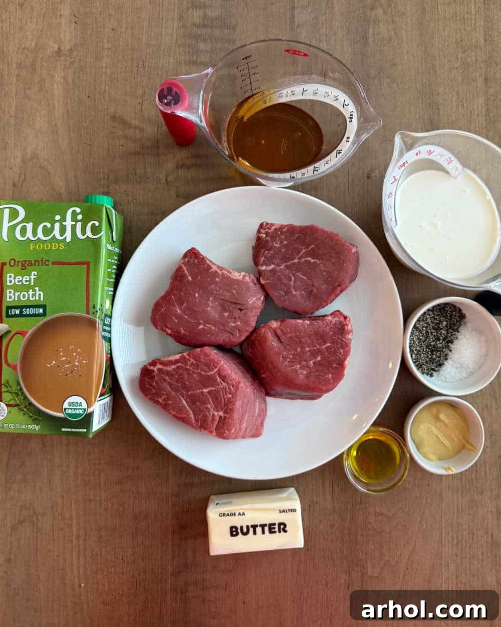 Effortless Peppercorn Steak 3 Raw filet mignon, salt, peppercorns, and sauce ingredients laid out before cooking.
