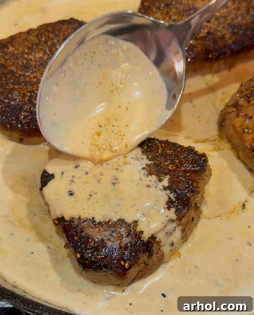 Effortless Peppercorn Steak 7 Spoon the luxurious bourbon cream sauce over the perfectly cooked beef filet.