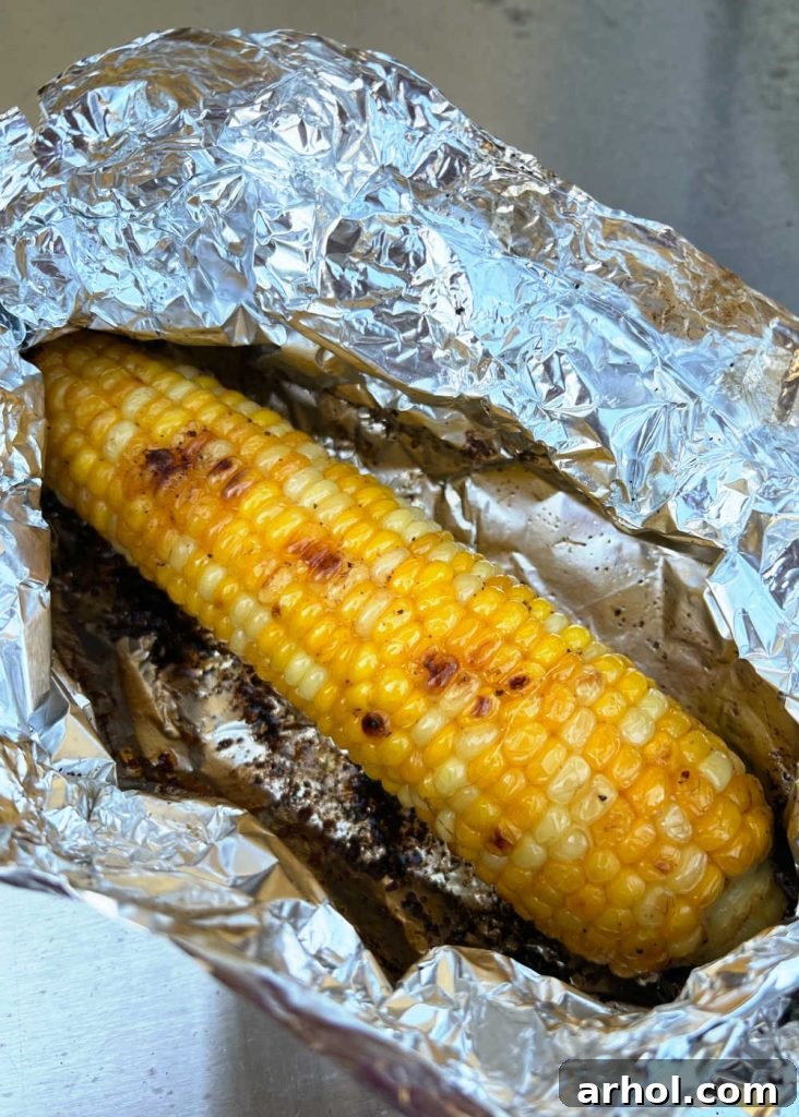Grilled corn in opened foil packet