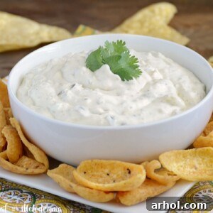 creamy salsa verde dip in bowl with chips