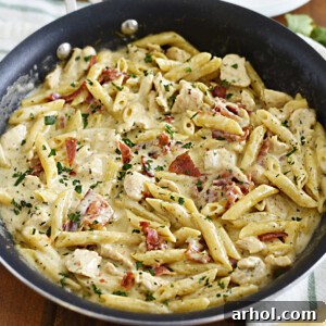 chicken bacon ranch pasta in skillet with parsley