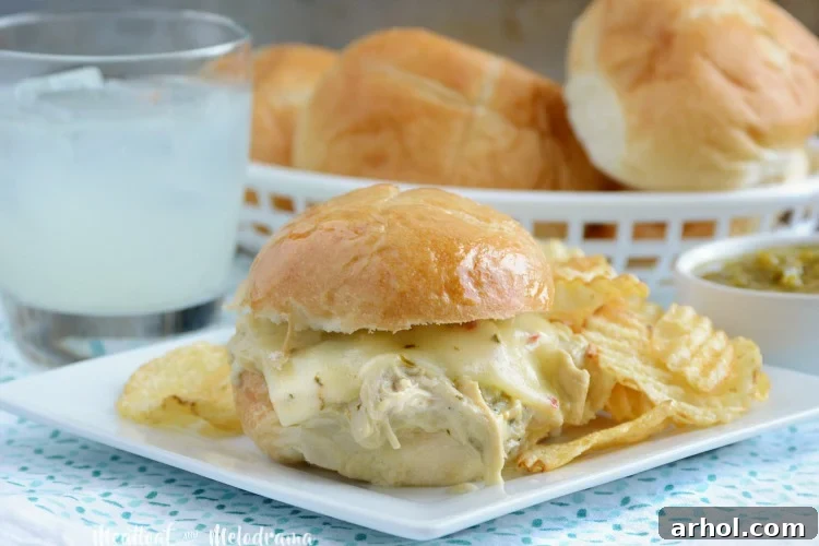Delicious Crock-Pot Salsa Verde Chicken Sliders served on a plate with tortilla chips