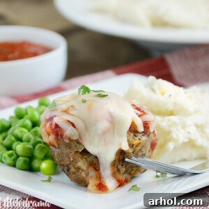 Italian meatloaf muffins with marinara sauce and provolone cheese on a plate