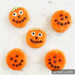 Halloween Oreo pumpkins in candy melts with candy eyes and mini chocolate chips