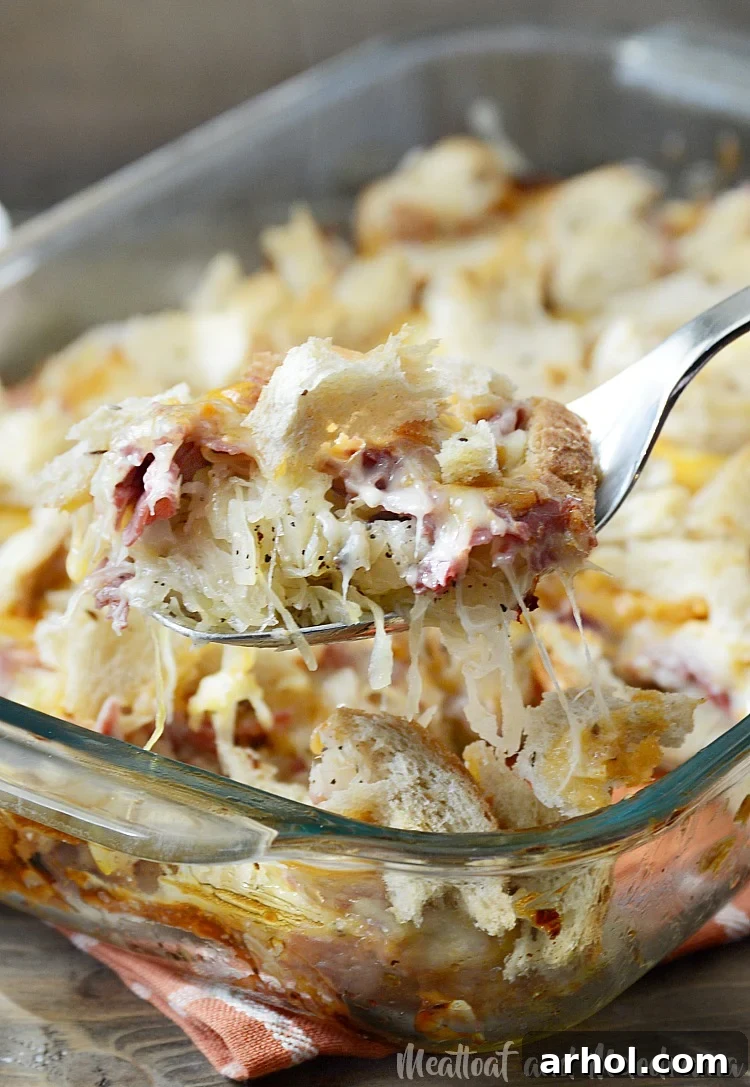 Easy baked Reuben casserole on a serving fork, ready to be eaten.