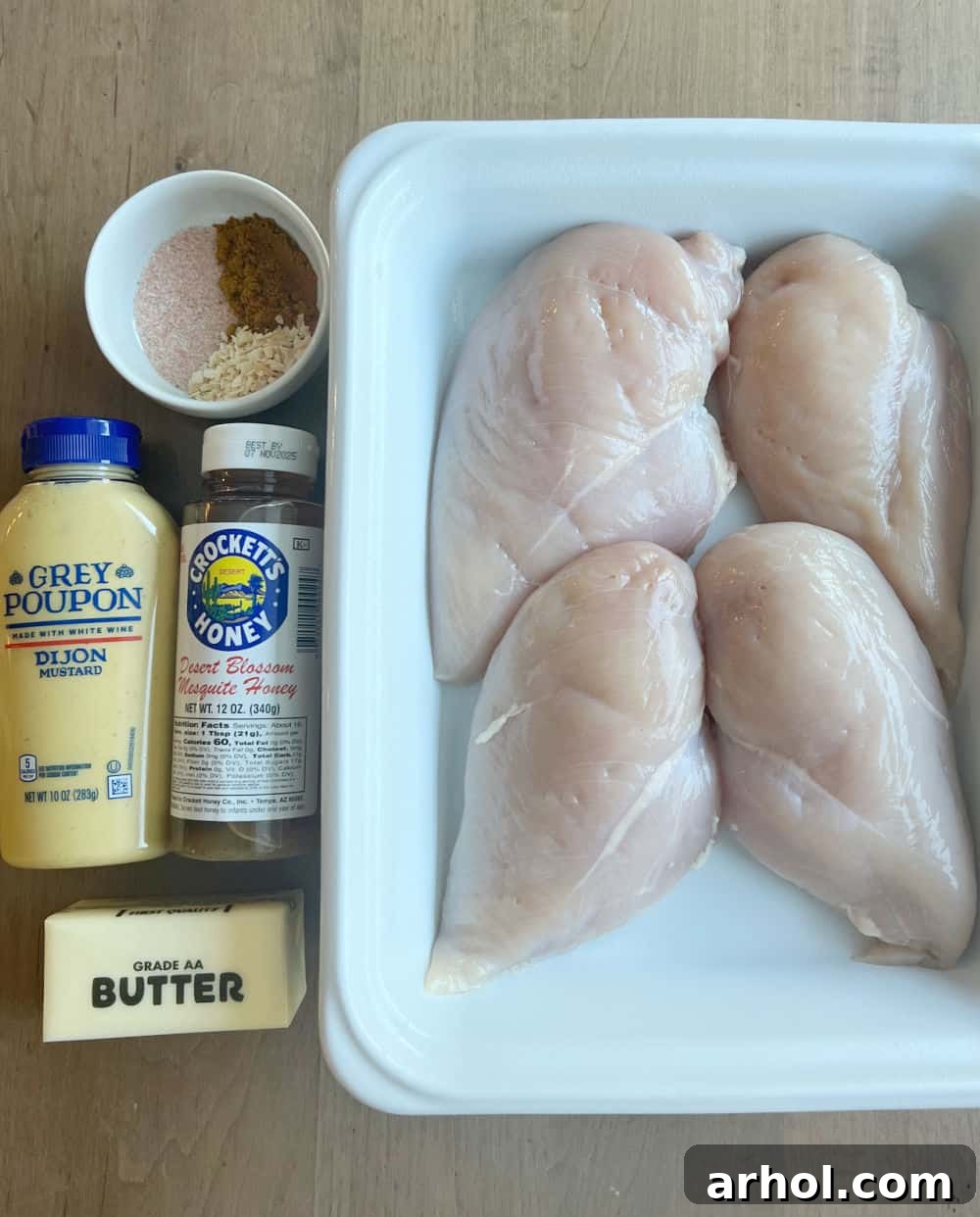 Key ingredients for Honey Mustard Curry Chicken: chicken breast, honey, dijon mustard, butter, and spices.
