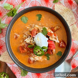 bowl of instant pot chicken enchilada soup on the table