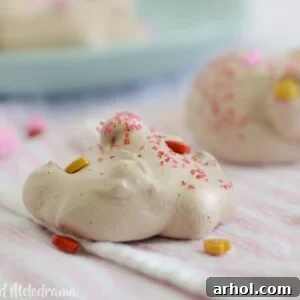 Double chocolate meringue cookies, beautifully decorated with candy hearts, a perfect dessert recipe.