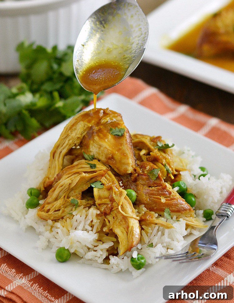 Pouring the honey mustard curry sauce over the chicken in the Instant Pot.