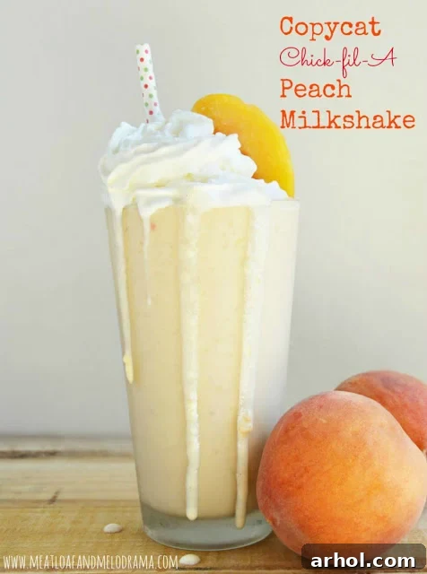 Copycat Chick-fil-A Peach Milkshake topped with whipped cream and a peach slice