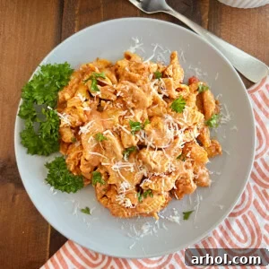 instant pot chicken pasta in creamy sauce with parmesan cheese on a plate