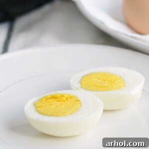 Instant Pot hard boiled eggs sliced, showcasing perfectly cooked yolks.