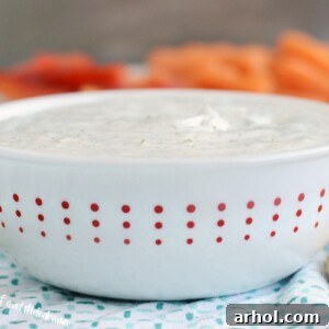 creamy dill dip recipe in red and white bowl