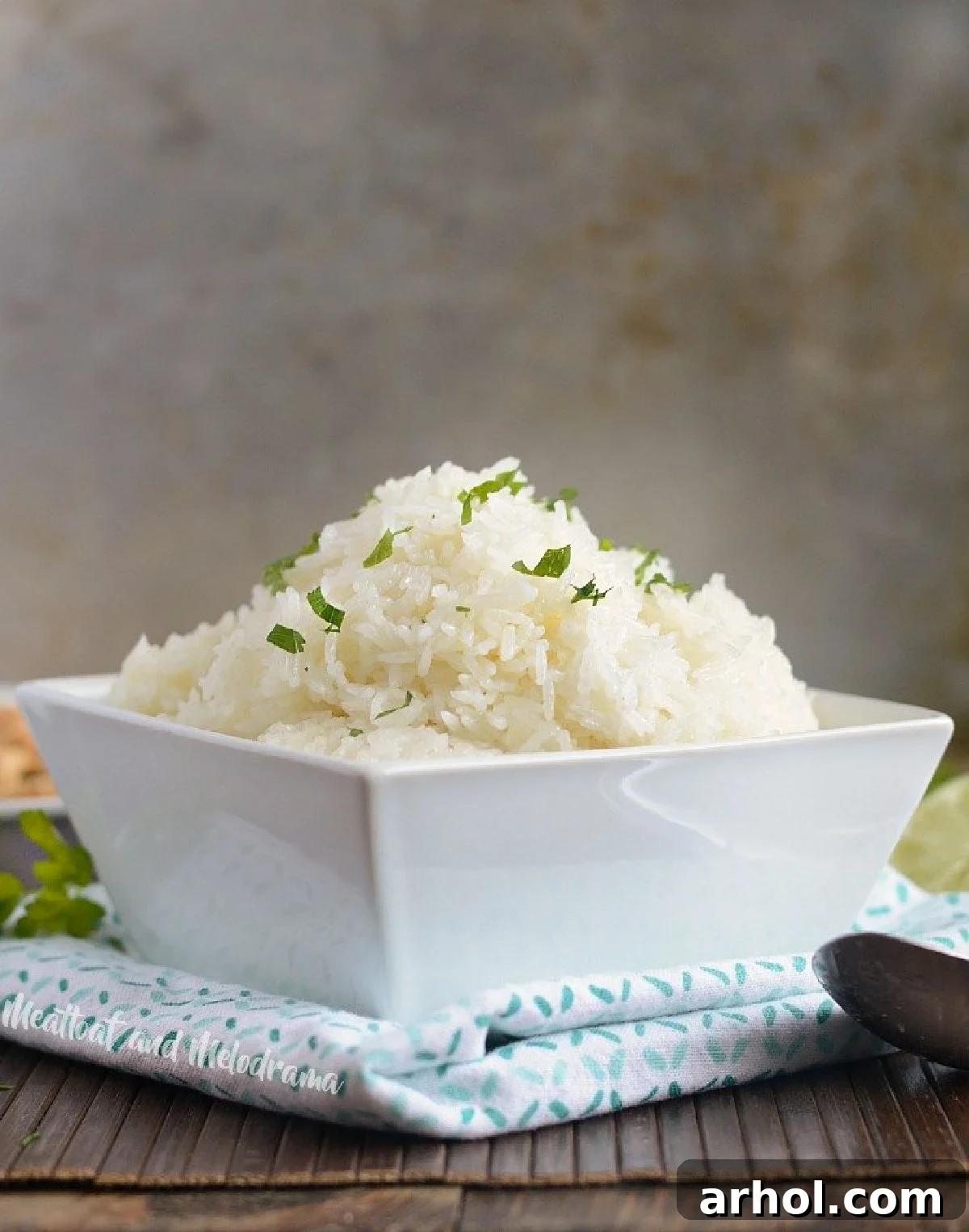 Instant Pot jasmine rice, garnished with fresh parsley, served in an elegant white bowl.