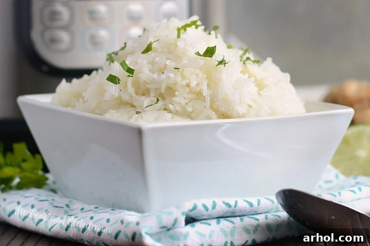 A serving of perfectly cooked Instant Pot jasmine rice in a clean white bowl, ready to be enjoyed.
