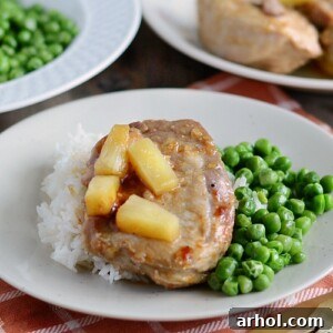instant pot hawaiian bbq pork chops on plate with rice and peas