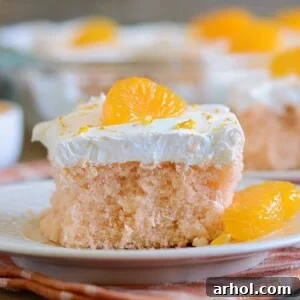 orange crush soda pop cake with cool whip frosting and mandarin orange slices