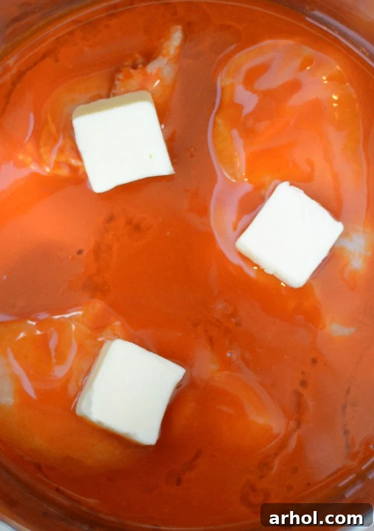 instant pot buffalo chicken recipe with sauce and butter in pot