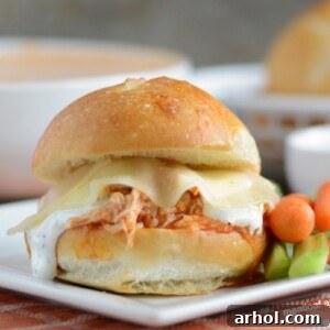 Instant Pot Buffalo Chicken Sliders with ranch and provolone cheese on plate