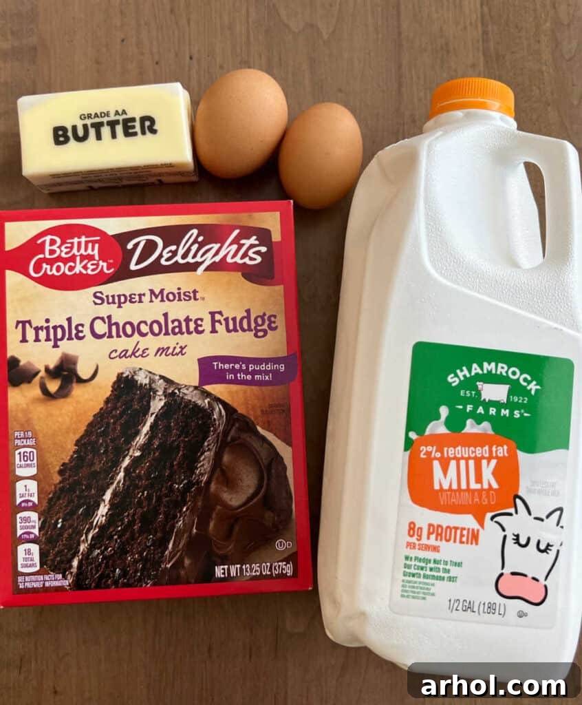 Essential ingredients for chocolate cake mix cookies: a box of chocolate cake mix, fresh eggs, creamy butter, and a splash of milk.