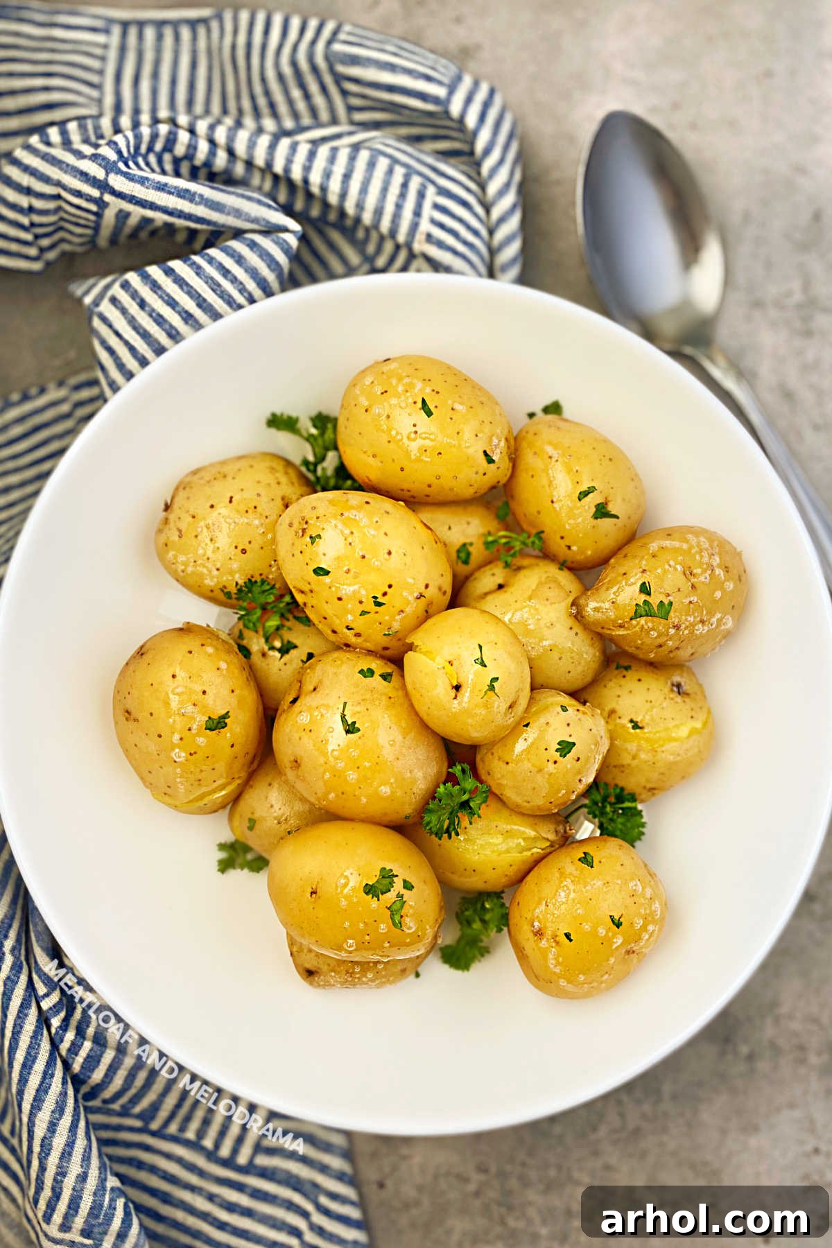 Instant Pot Baby Potatoes in Minutes 2 Bowl of perfectly steamed baby yellow potatoes garnished with fresh parsley, ready to serve as an easy Instant Pot side dish.