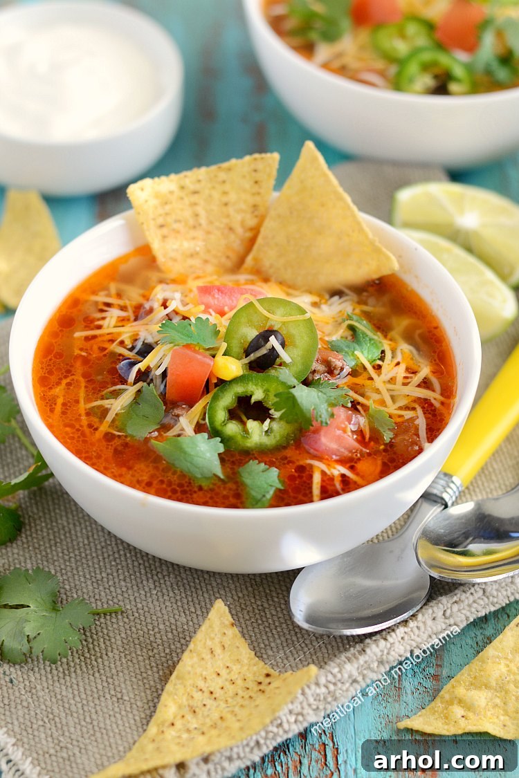Effortless Instant Pot Taco Soup 5 instant pot taco soup with tortilla chips, cheese, jalapeno peppers on top