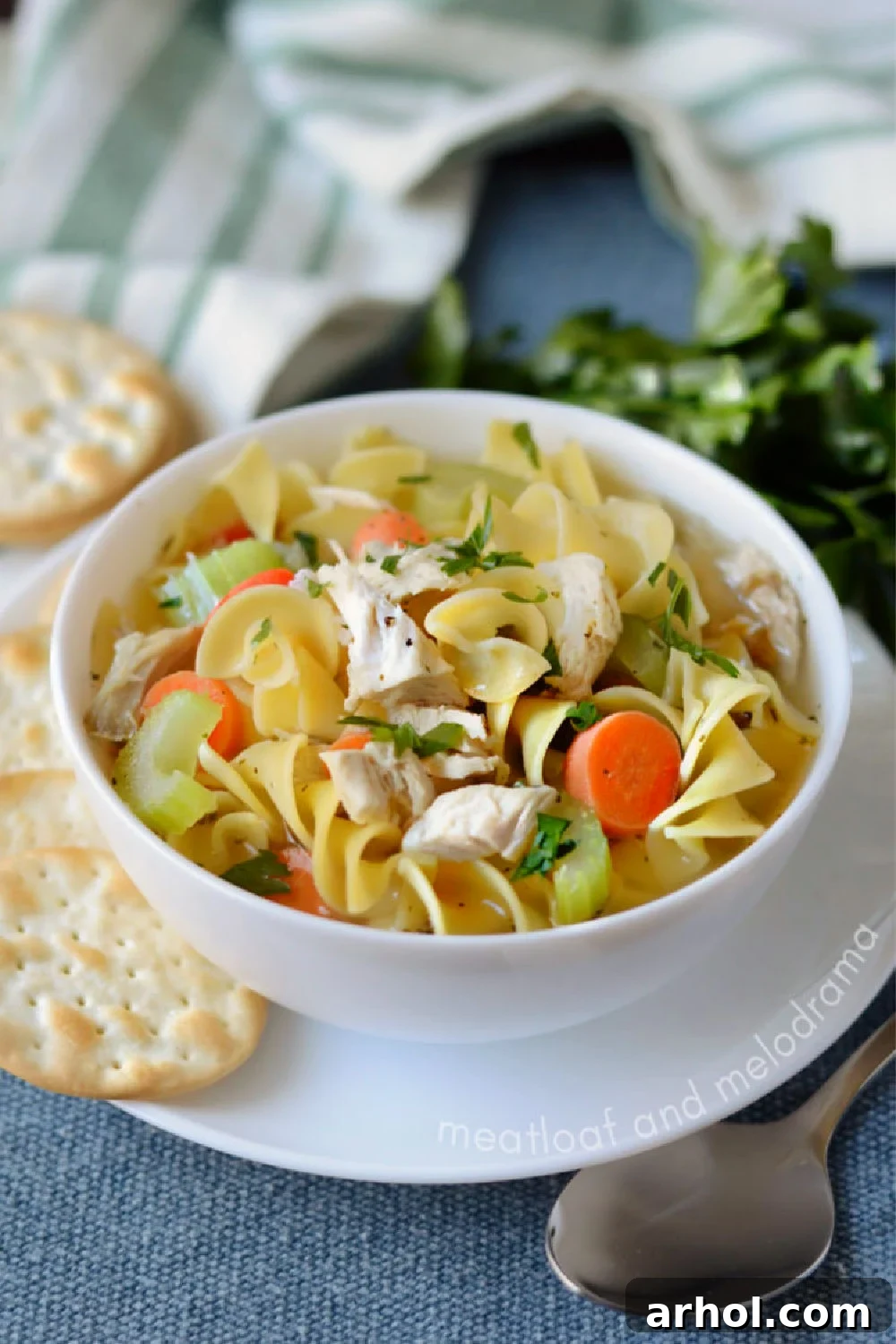 Instant Pot Turkey Carcass Soup in a white bowl, ready to be enjoyed