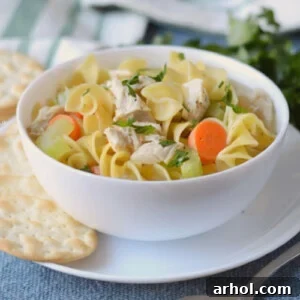 Instant pot turkey soup with noodles in a white bowl