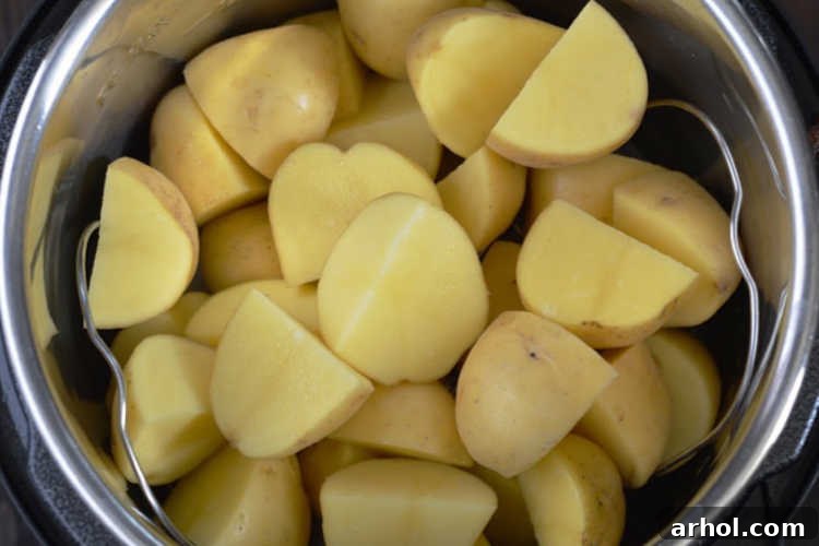 Quartered potatoes ready for cooking in an Instant Pot