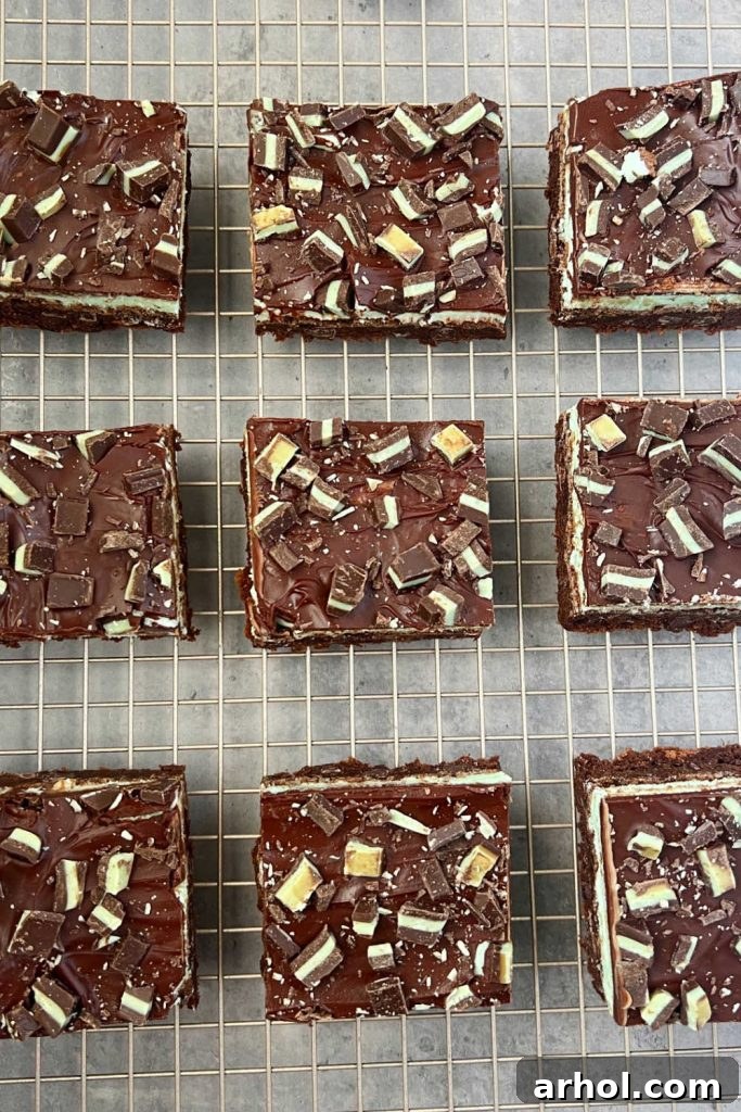 Chocolate mint brownies with Andes mints cooling on a wire rack.