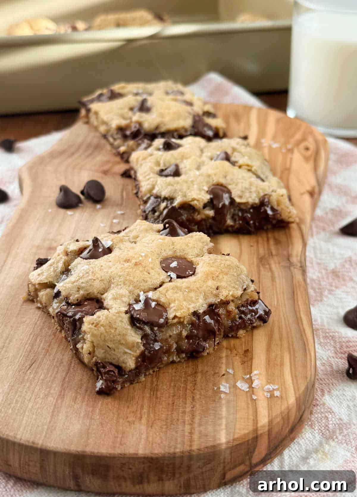 Gooey Oatmeal Chocolate Chip Cookie Bars topped with flaky sea salt.