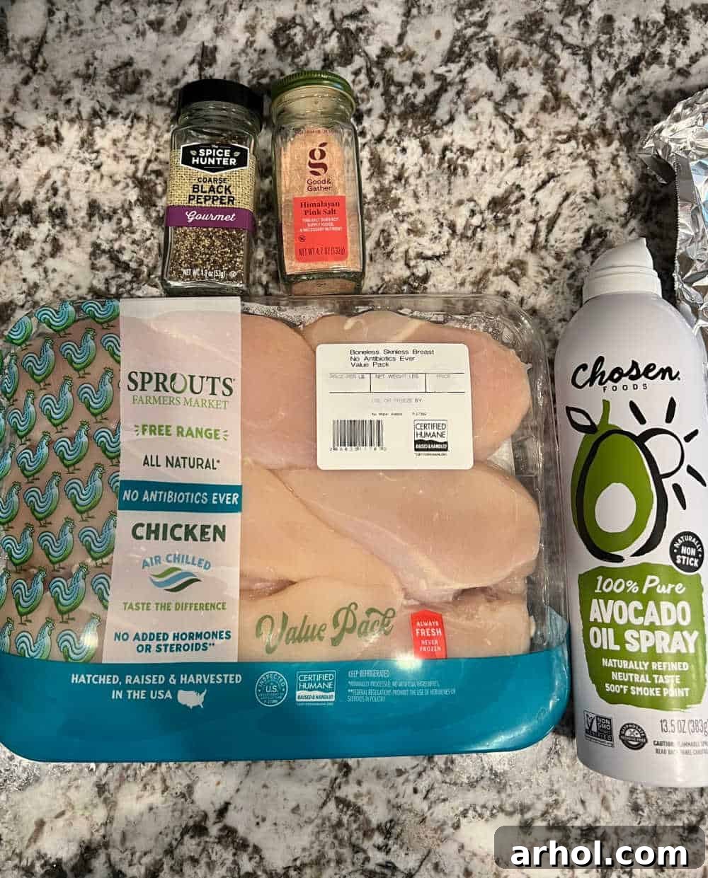 The simple, essential ingredients for baked chicken: boneless skinless chicken breast, avocado oil, sea salt, and black pepper.