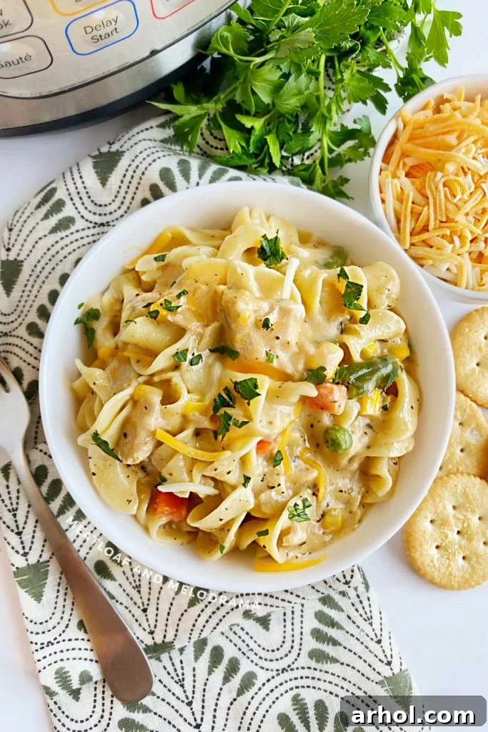 Instant Pot Tuna Noodle Casserole served in a rustic white serving bowl, ready to be enjoyed.