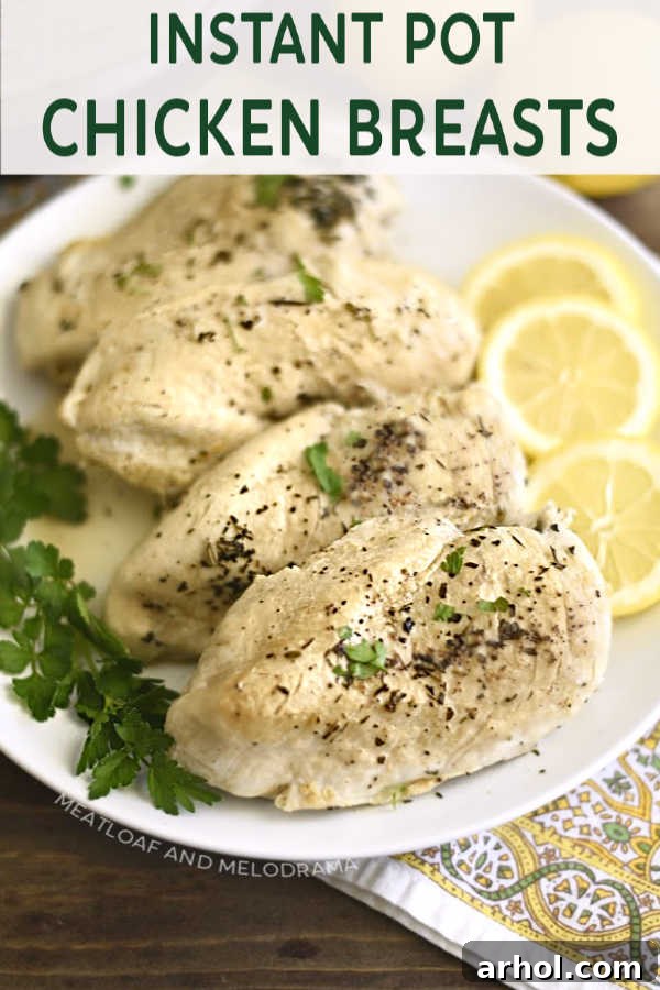 Pressure cooker chicken breasts on a platter with lemon and parsley, ready to serve.