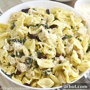 creamy chicken tortellini in white bowl