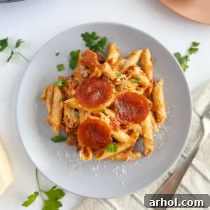 instant pot pizza pasta with pepperoni slices on a plate