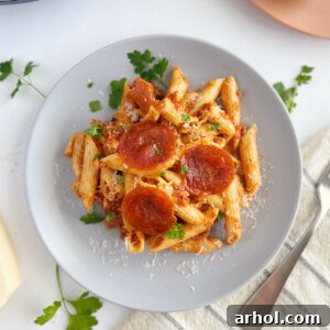Instant Pot Pizza Pasta with pepperoni slices on a plate.