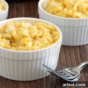 Creamy Instant Pot Mac and Cheese served in white ramekins.