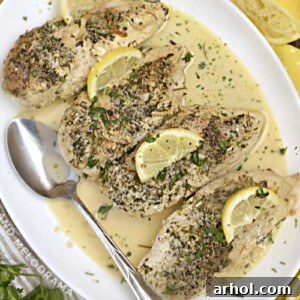Instant Pot Creamy Lemon Garlic Chicken Breasts with Lemon Slices on a White Platter