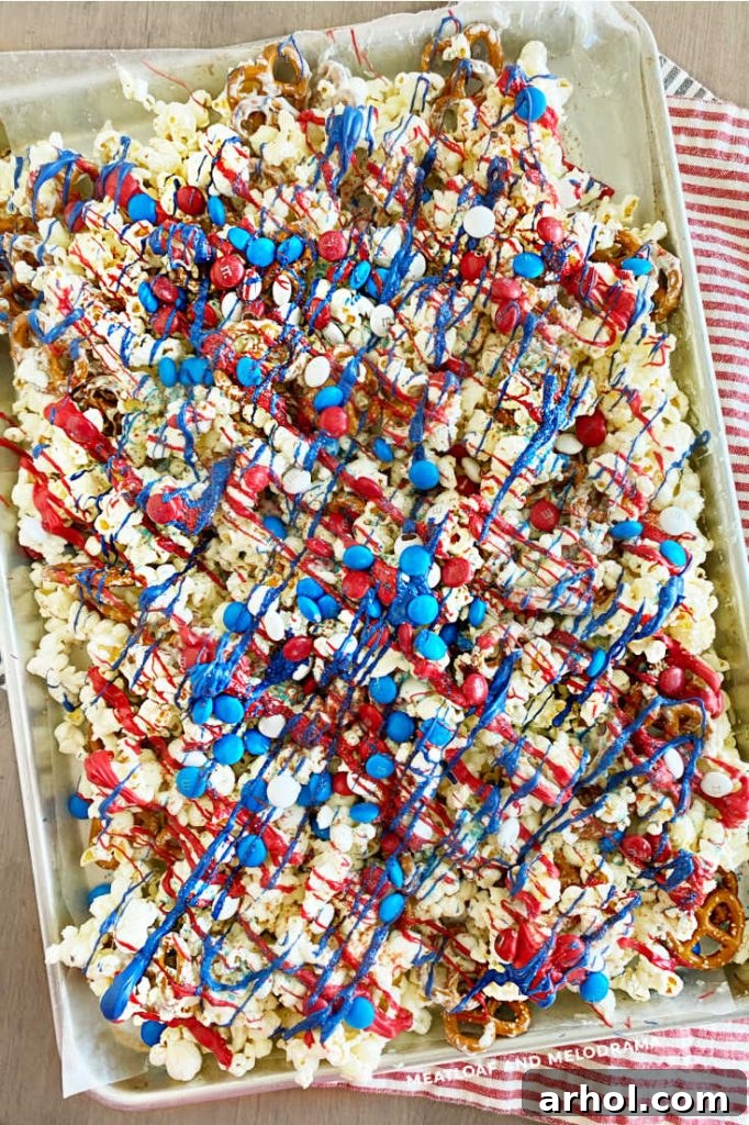 Stars and Stripes Popcorn Treat 7 Tray filled with festive red, white, and blue snack mix, ready to be broken into pieces