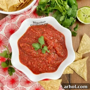 red blender salsa in a white bowl