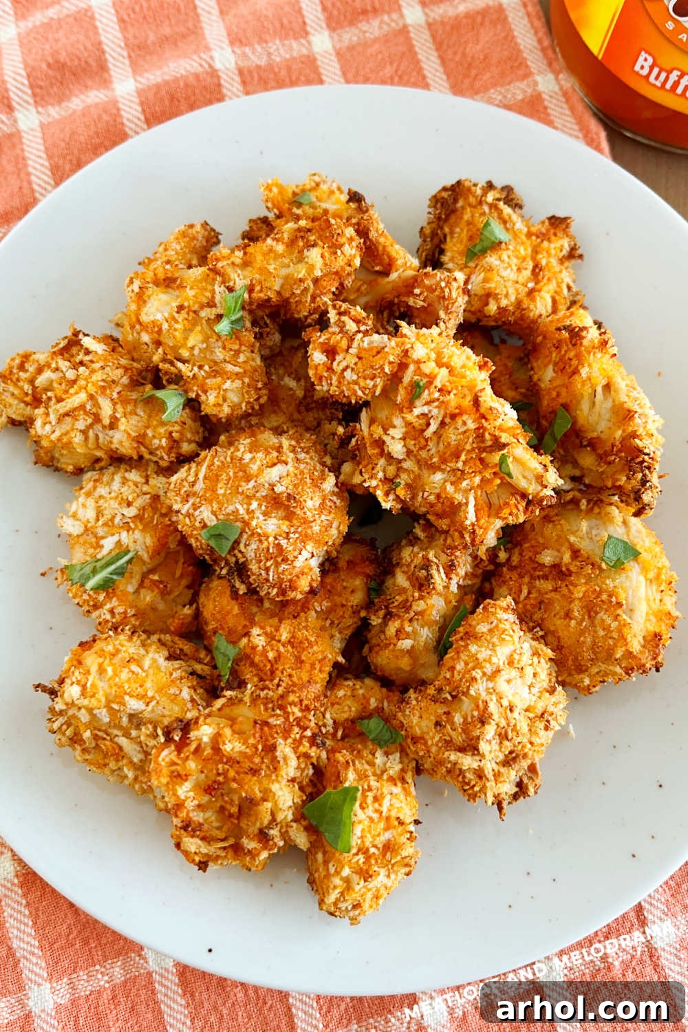 Crispy Air Fryer Buffalo Chicken Bites with Panko Bread Crumbs on a Plate, ready to serve.