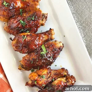 Air Fryer BBQ Chicken Wings with barbecue sauce on platter
