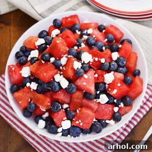 watermelon feta blueberry salad in a white bowl on the table.