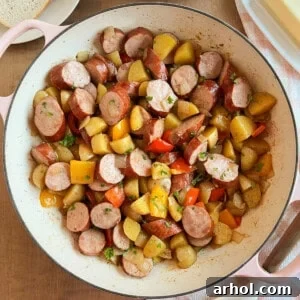 fried kielbasa with potatoes and peppers.