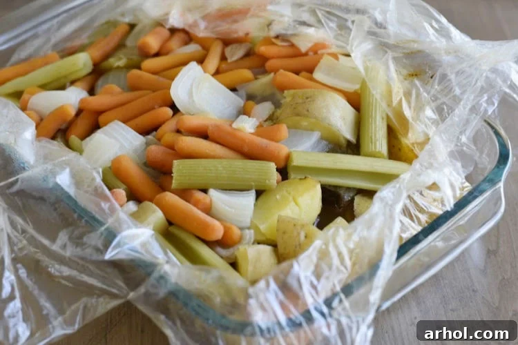 The beef pot roast and accompanying vegetables are perfectly baked in an oven bag, retaining all their moisture and flavor.