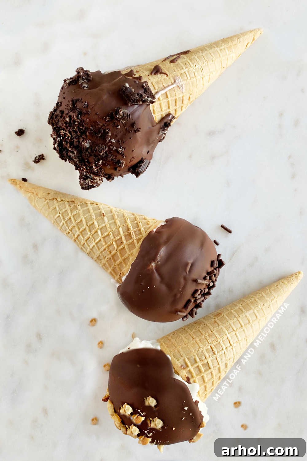 homemade drumstick ice cream cones with chocolate shell on marble surface, showcasing perfect texture and toppings