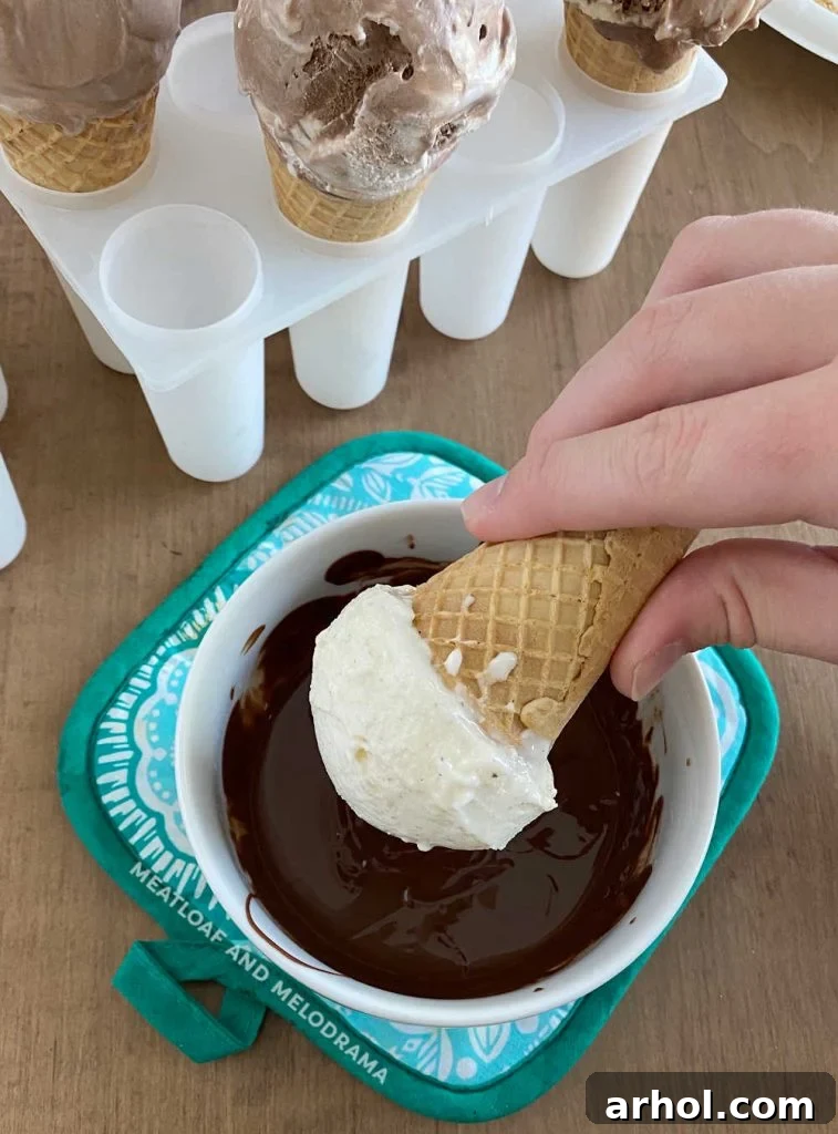 dip ice cream into melted chocolate magic shell, showing the coating process