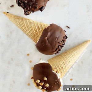 homemade drumsticks ice cream cones with chocolate coating on marble surface, ready to serve