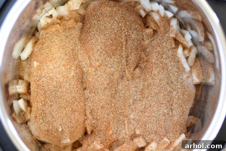 seasoned chicken breasts and onions in the instant pot pressure cooker